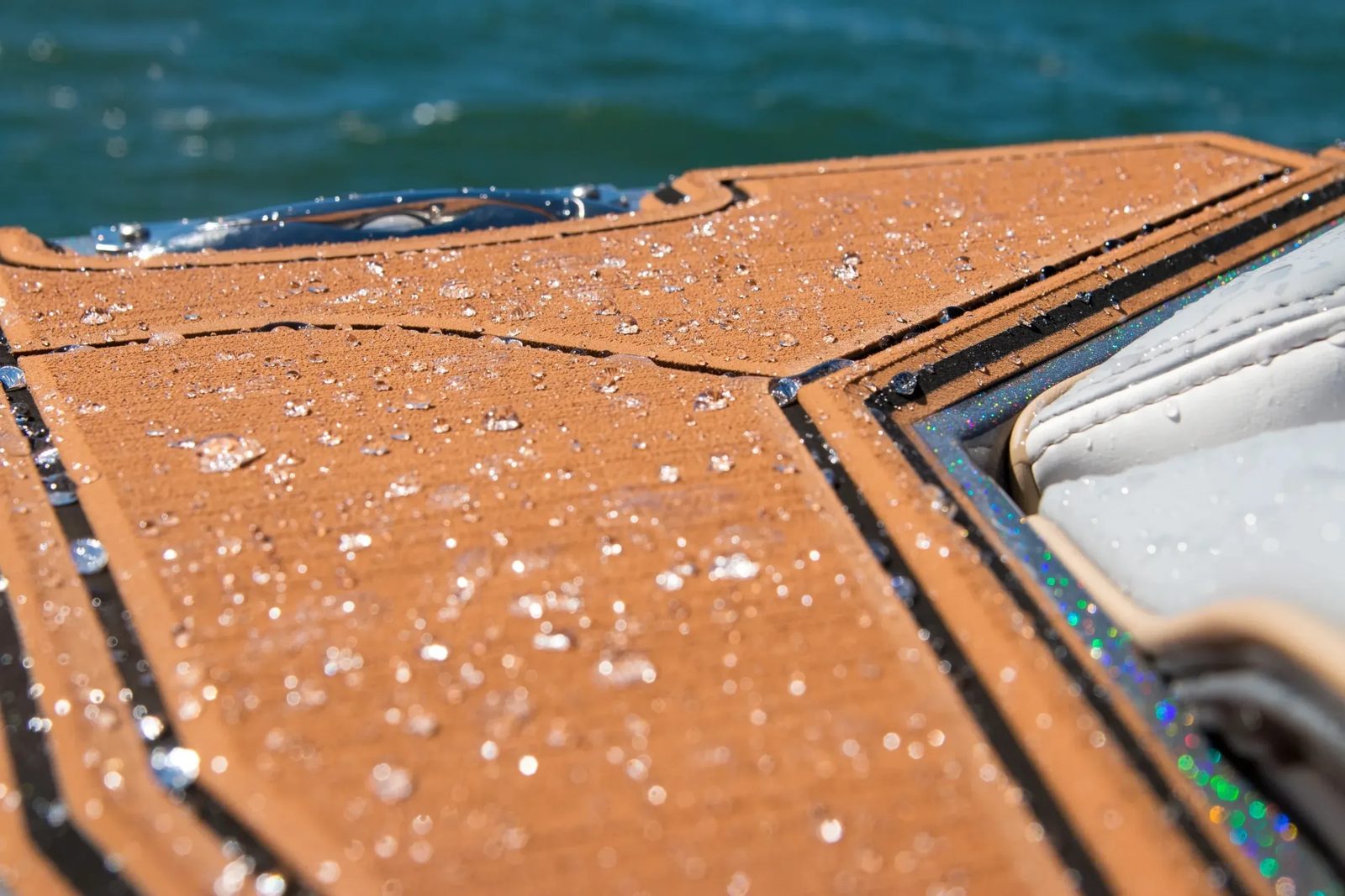 Water beading on brushed faux teak EVA decking